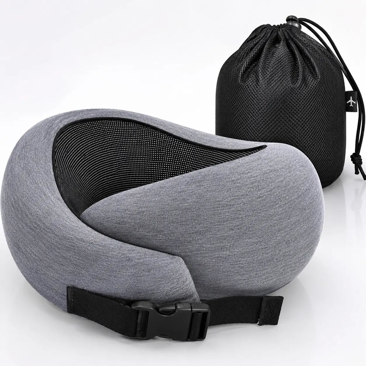 A gray and black travel neck pillow with an adjustable black strap, shown in front of a black drawstring storage bag on a white background.