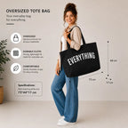 Black oversized Everything tote bag carried by a woman with 73 × 44 × 17 cm size specifications