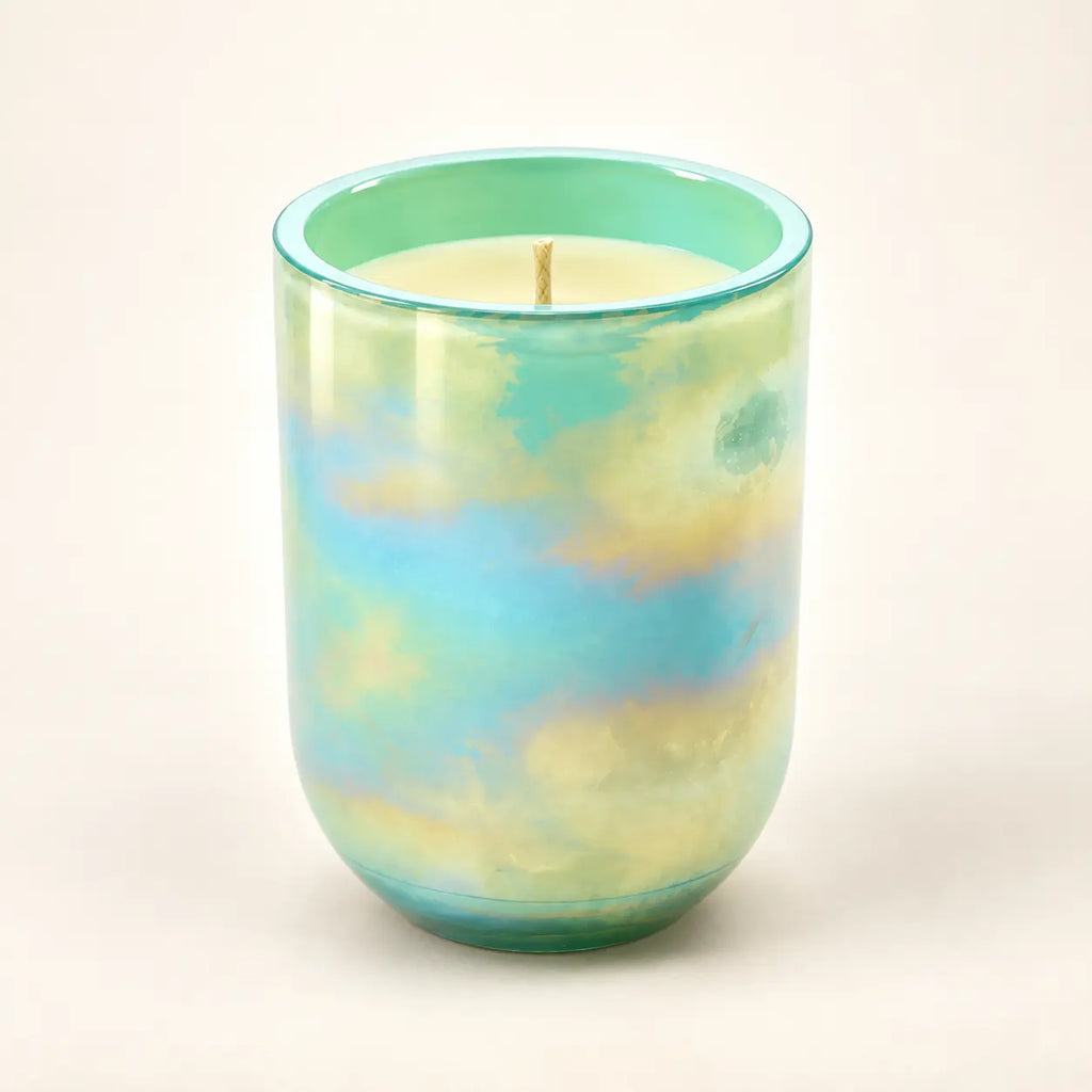 Pastel Glow scented wax candle in a pastel marbled glass vessel with mint green, pale yellow, and soft aqua blue tones.