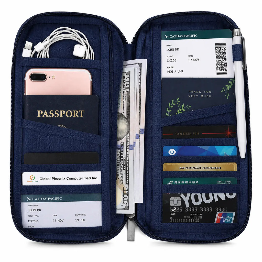 Open travel passport wallet organizer with passport, phone, cash, boarding passes, cards, cables, and pen in multiple compartments