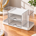 White acrylic makeup organizer with two clear drawers and spacious side compartments on a wooden vanity.